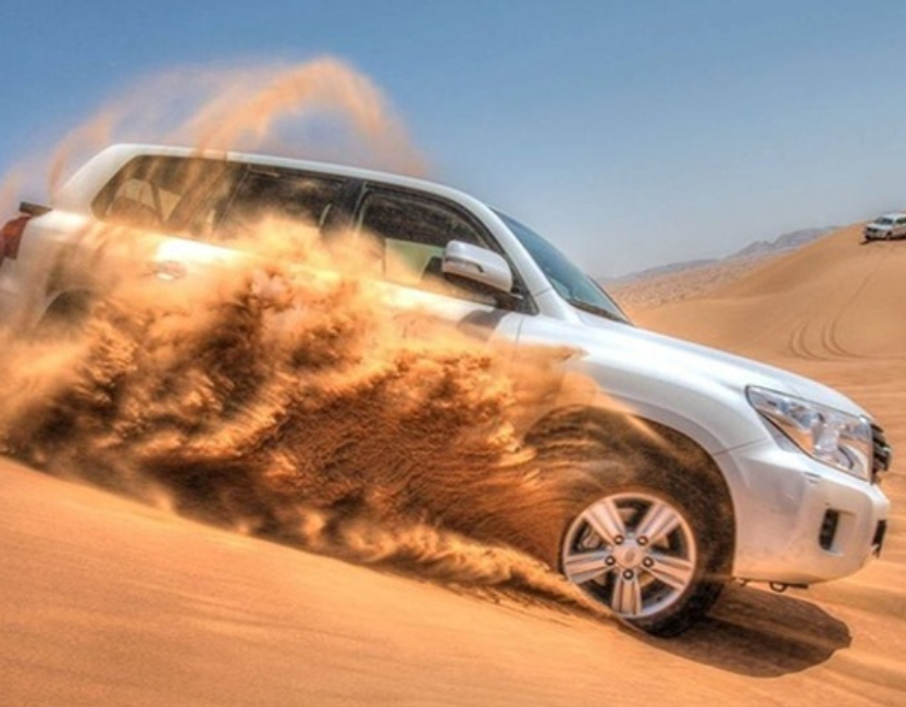 Private Morning Desert Safari Dubai with dune bashing, camel ride, sandboarding, and golden sunrise views